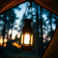 Magnetic camp lantern hanging in tent at dusk