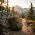 Tactical backpack on a Sierra mountain trail at golden hour