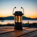 Solar camp lantern at lakeside at twilight