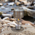Stainless steel folding stove holder with pot above flame